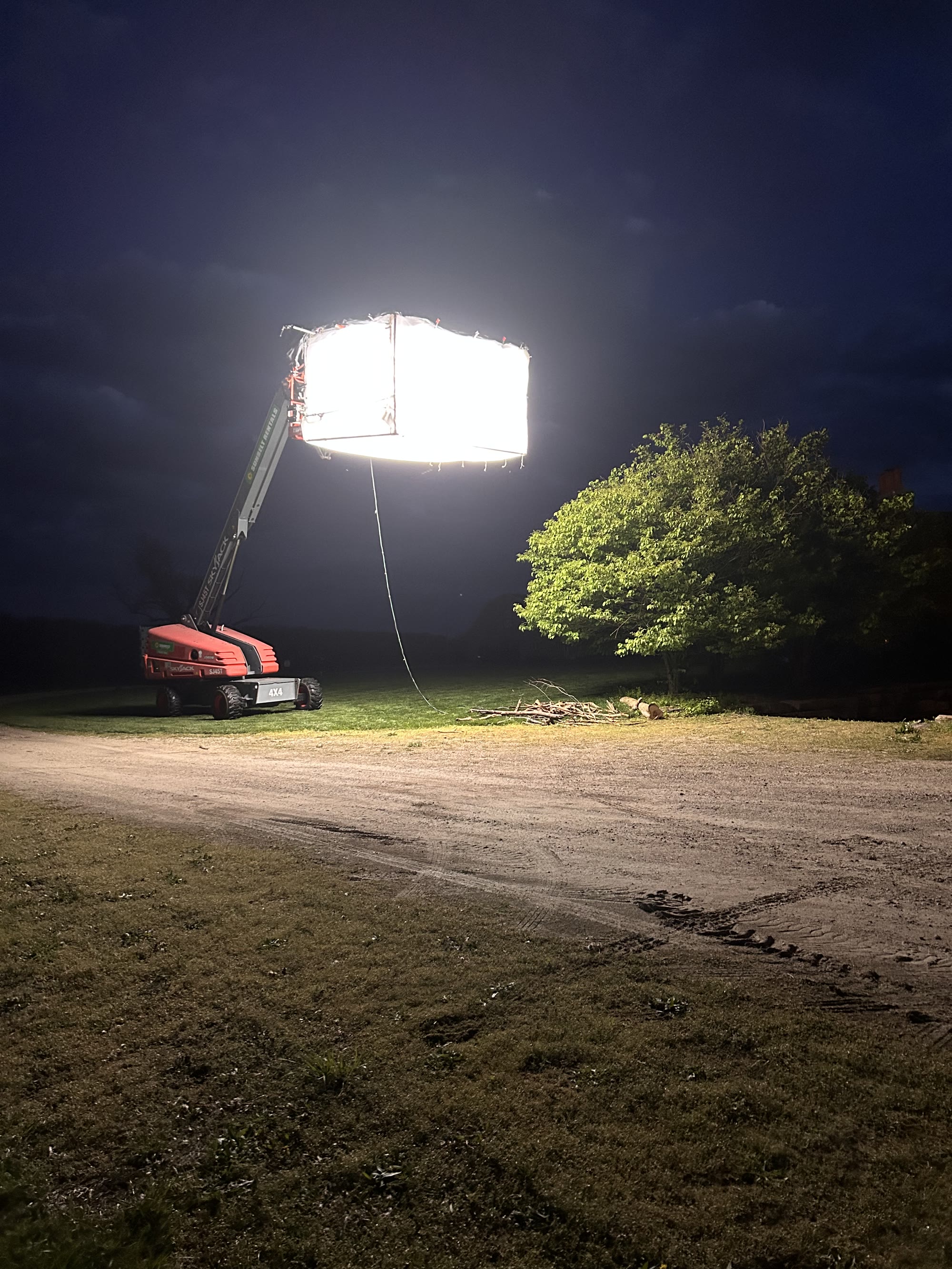 Large location light illuminating a nighttime film set